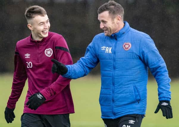 Andy Kirk  with Harry Cochrane, left, during Hearts' training.