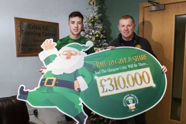 Celtics Mikey Johnson, left, and Neil Lennon thanked contributors to the clubs 2019 Christmas Appeal which raised £310,000, all of which has been distributed to a variety of causes including families with children in need, OAPs, the homeless and Womens Aid. Picture: Craig Foy/SNS