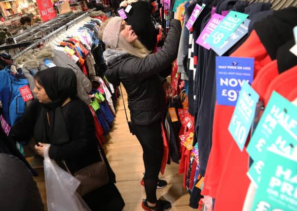 Customers on the hunt for bargains at the Boxing Day Sales at the Next store on Princes Street. Picture: Stuart Attwood