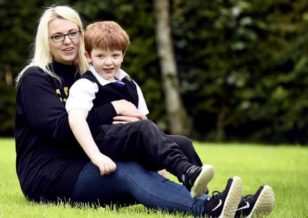 Murray Gray, who has Doose syndrome, and his mother Karen. Picture: Lisa Ferguson