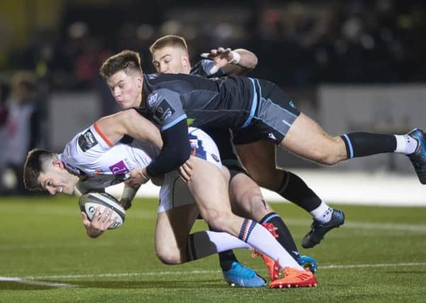 Glasgow's Huw Jones tackles Blair Kinghorn during the first 1872 Cup game at Scotstoun. Picture: Gary Hutchison/SNS