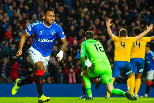 Alfredo Morelos runs off in celebration after giving Rangers the lead. Picture: SNS