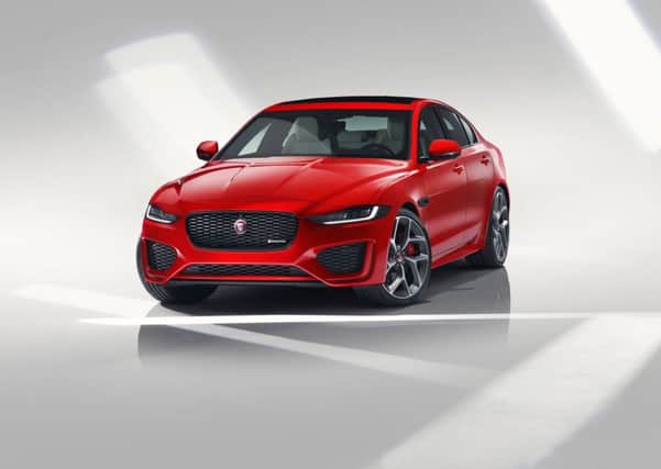 The front headlamps are slimmer, changing the shape of the XE's face