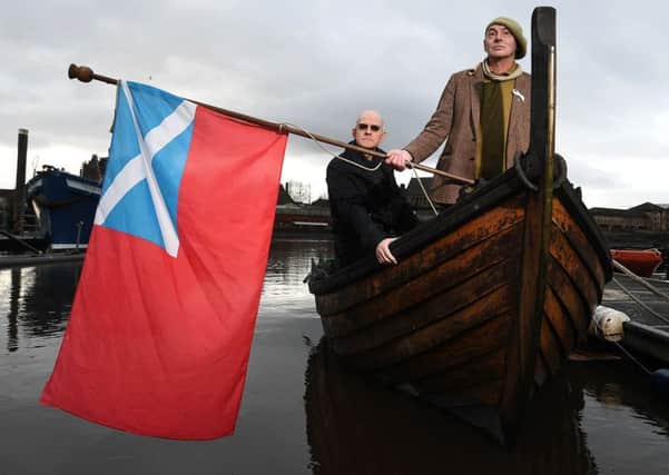 Ian Bogle, right, and Alastair Hart aboard a replica birlinn vessel on the Clyde. Picture: John Devlin