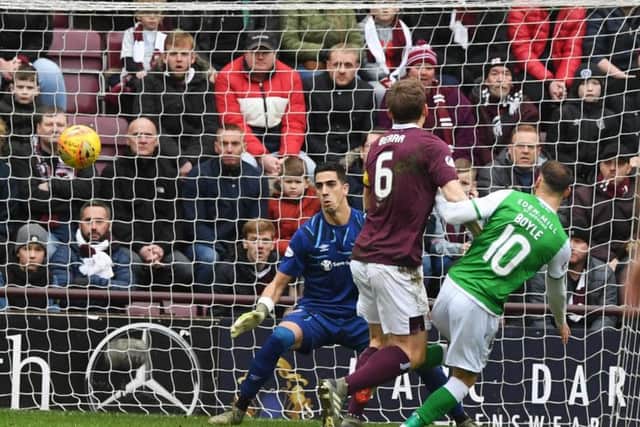 Joel Pereira is beaten by Martin Boyle for the first goal in Boxing Day's Edinburgh derby. Picture: SNS