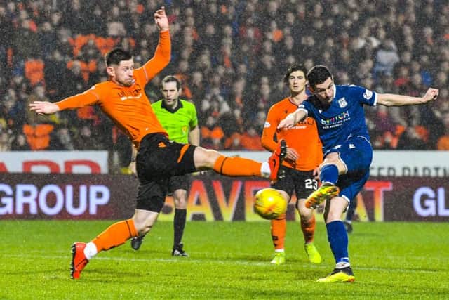 Graham Dorrans fires home Dundee's equalising goal five minutes into the second half. Picture: Rob Casey/SNS