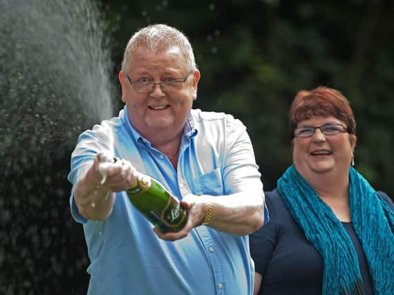 Colin Weir celebrates his lottery win. Picture: Getty Images