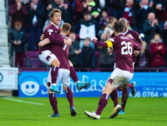 Ryotaro Meshino is congratulated after scoring the opener