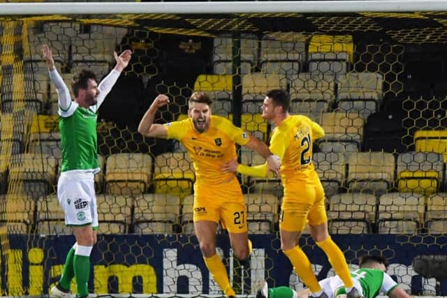 Jason Naismith appeals to the officials as Jon Guthrie celebrates scoring for Livingston