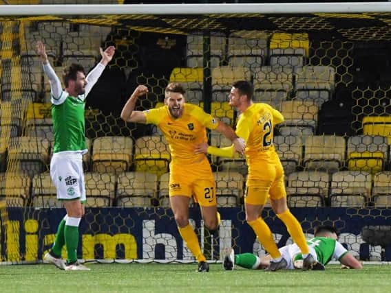 Jason Naismith appeals to the officials as Jon Guthrie celebrates scoring for Livingston