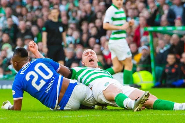 Scott Brown tussles with Alfredo Morelos during the final Old Firm clash of 2019