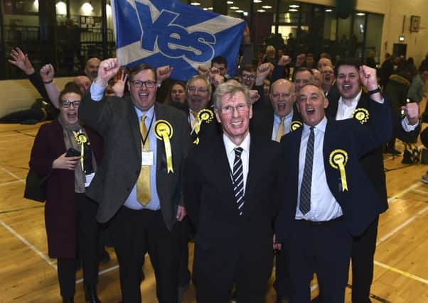 Kenny MacAskill celebrates with supporters after winning in East Lothian. Picture: Lisa Ferguson