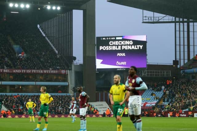Play is halted during an English Premier League match between Aston Villa and Norwich City for a VAR check