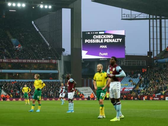 Play is halted during an English Premier League match between Aston Villa and Norwich City for a VAR check
