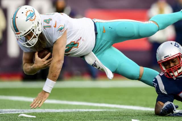 Miami Dolphins quarterback Ryan Fitzpatrick dives for the winning touchdown. Picture: Billie Weiss/Getty Images