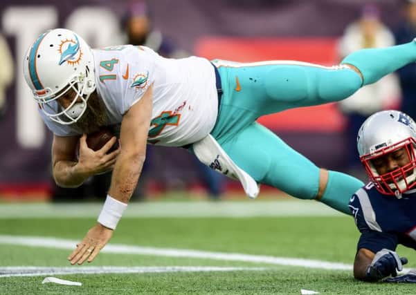 Miami Dolphins quarterback Ryan Fitzpatrick dives for the winning touchdown. Picture: Billie Weiss/Getty Images