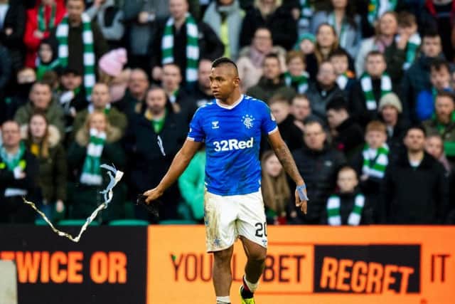 Alfredo Morelos makes his way from the pitch after being sent off against Celtic