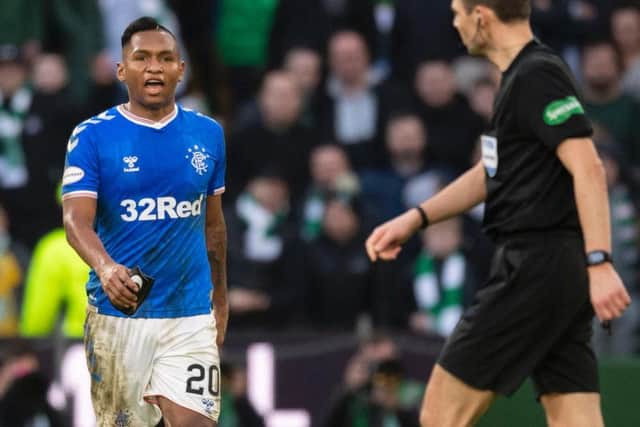 Alfredo Morelos exchanges words with referee Kevin Clancy after his dismissal against Celtic