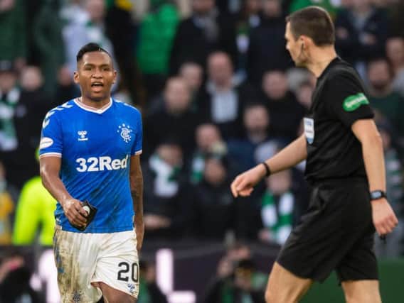 Alfredo Morelos exchanges words with referee Kevin Clancy after his dismissal against Celtic