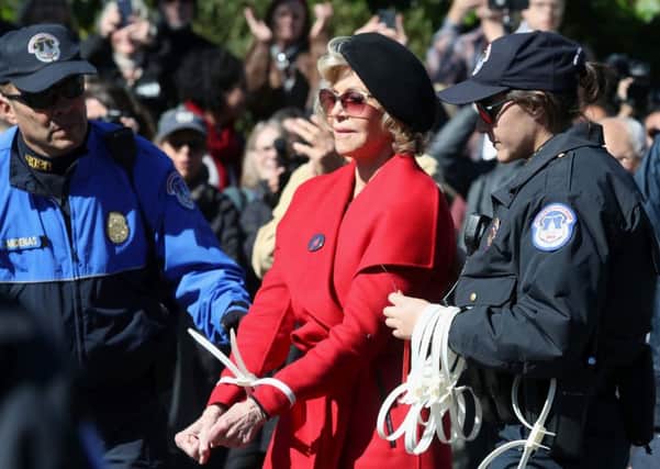 Jane Fonda is arrested for blocking a street in front of the US Capitol during a Fire Drill Fridays climate change protest in Washington DC in October (Picture: Mark Wilson/Getty Images)