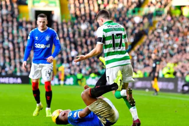 Ryan Christie tussles with Alfredo Morelos during Rangers' 2-1 win at Celtic Park. Picture: Rob Casey / SNS