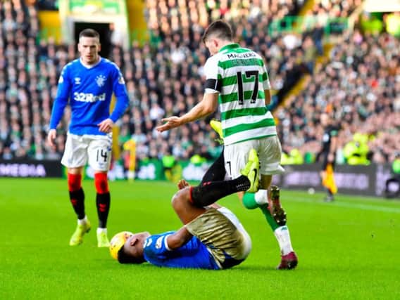 Ryan Christie tussles with Alfredo Morelos during Rangers' 2-1 win at Celtic Park. Picture: Rob Casey / SNS
