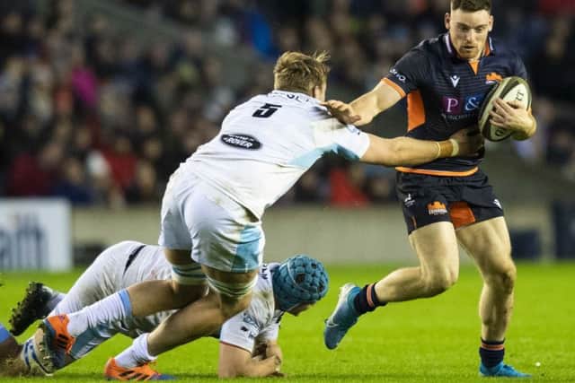 George Taylor is tackled by Glasgows Jonny Gray during the second leg of the 1872 Cup tie on Saturday. Picture: SNS/SRU