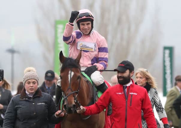 Harry Skelton celebrates his victory on Oldgrangewood. Picture: PA.