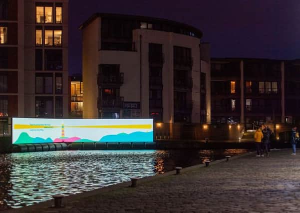 Kathleen Jamie's words are projected beside the Union Canal, Fountainbridge as part of Message From the Skies