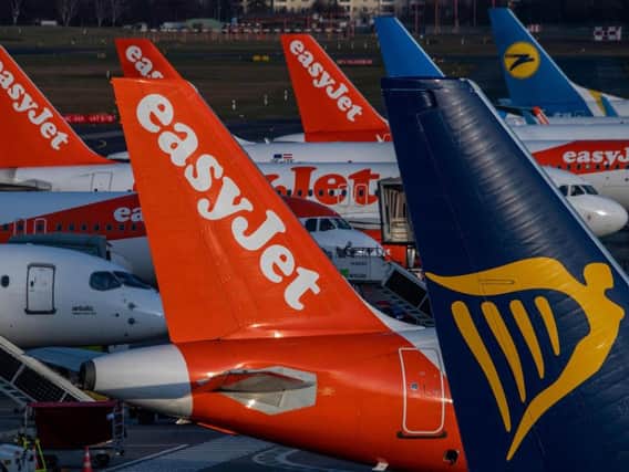 A passenger has died after falling ill on board a flight to the UK from Spain, easyJet has said.