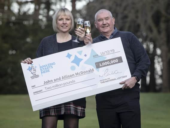 John and Alison McDonald, from Stockton On Tees, celebrate their 2m jackpot win.  Pic: Danny Lawson/PA