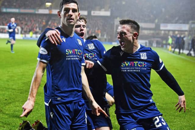 Graham Dorrans celebrates his equaliser in Dundee's derby draw with Dundee United in December. Picture: Rob Casey/SNS