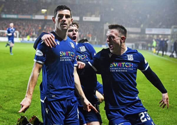 Graham Dorrans celebrates his equaliser in Dundee's derby draw with Dundee United in December. Picture: Rob Casey/SNS