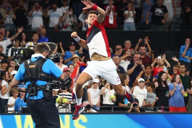 Novak Djokovic shows what an ATP Cup victory means to him after a tight match with South Africas Kevin Anderson. Photograph: Chris Hyde/Getty