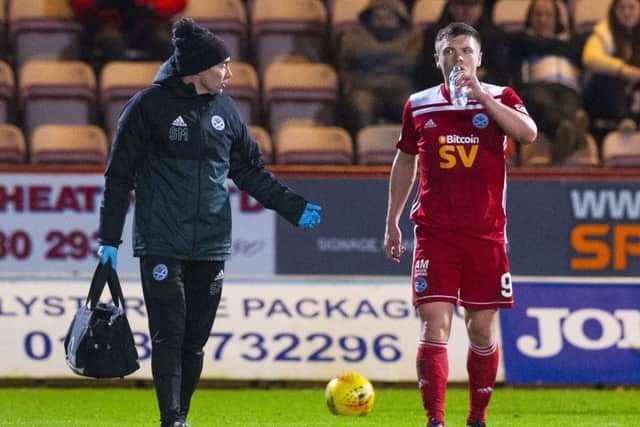 Craig Moore leaves the field injured.Picture: SNS.