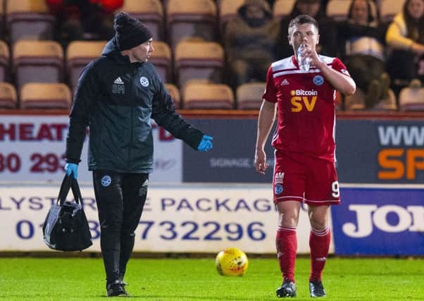Craig Moore leaves the field injured.Picture: SNS.