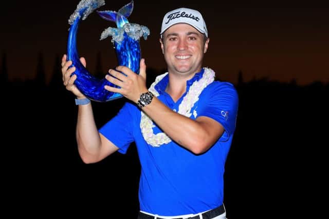 Justin Thomas shows off the Sentry Tournament of Champions trophy after his play-off win in Hawaii. Picture: Getty Images