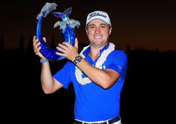 Justin Thomas shows off the Sentry Tournament of Champions trophy after his play-off win in Hawaii. Picture: Getty Images