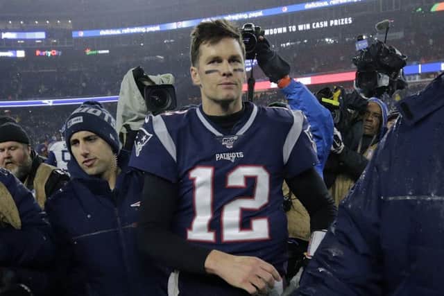 Tom Brady walks off the Foxborough pitch, possibly for the last time, following Patriots 20-13 defeat. Picture: Charles Krupa/AP