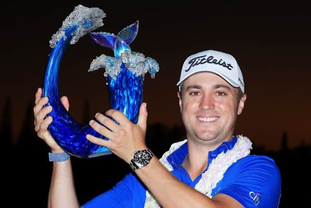 Justin Thomas shows off the Sentry Tournament of Champions trophy after his win in Hawaii. Picture: Getty