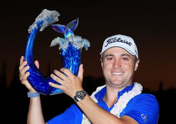 Justin Thomas shows off the Sentry Tournament of Champions trophy after his win in Hawaii. Picture: Getty