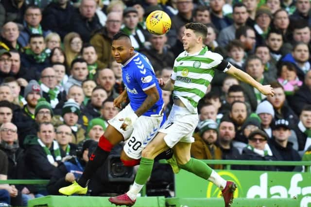Rangers' Alfredo Morelos, left, and Celtic's Ryan Christie tussle during the game on 29 January.