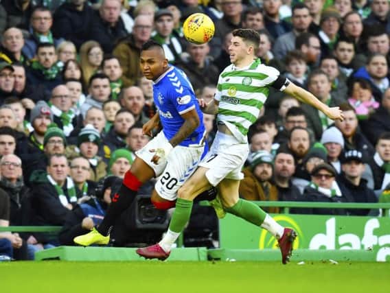 Rangers' Alfredo Morelos, left, and Celtic's Ryan Christie tussle during the game on 29 January.