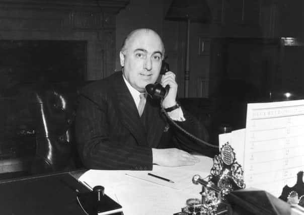 29th October 1951:  Scottish jurist and statesman Sir David Maxwell Fyfe (1900 - 1967), 1st Earl of Kilmuir, home secretary and minister for Welsh affairs, speaking on the telephone.  (Photo by Monty Fresco/Topical Press Agency/Getty Images)
