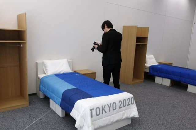 A journalist films a cardboard bed in the Tokyo 2020 Olympic and Paralympic Villages. Picture: Jae C Hong/AP