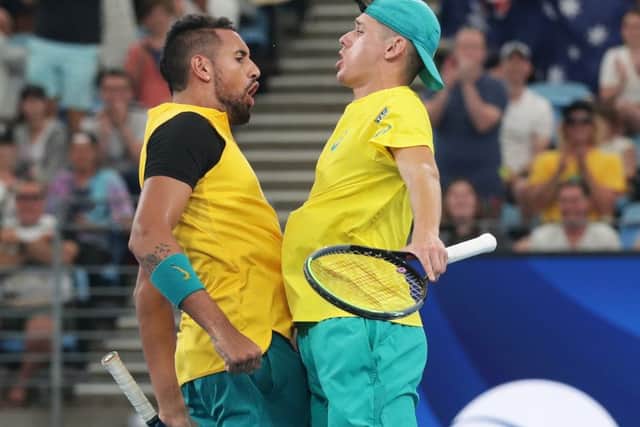 Nick Kyrgios and Alex De Minaur do a chest bump after their quarter-final victory in the ATS Cup. Picture: Getty.