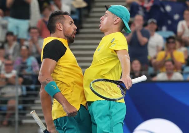 Nick Kyrgios and Alex De Minaur do a chest bump after their quarter-final victory in the ATS Cup. Picture: Getty.