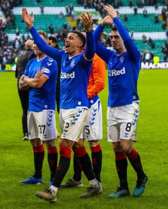 James Tavernier, centre, celebrates in front of the Rangers fans after his sides 2-1 league win at Celtic Park before the winter break. Picture: Rob Casey/SNS