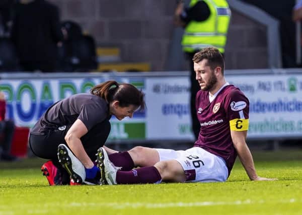 Hearts physio Karen Gibson attends to Craig Halkett after the defender sustained an injury during their Premiership clash against St Mirren in September, which resulted in him being out of actrion for more then two months. Picture: SNS.