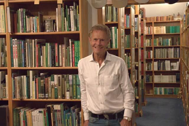 Alastair Johnson with his collection of books, which he is donating to the R&A in St Andrews